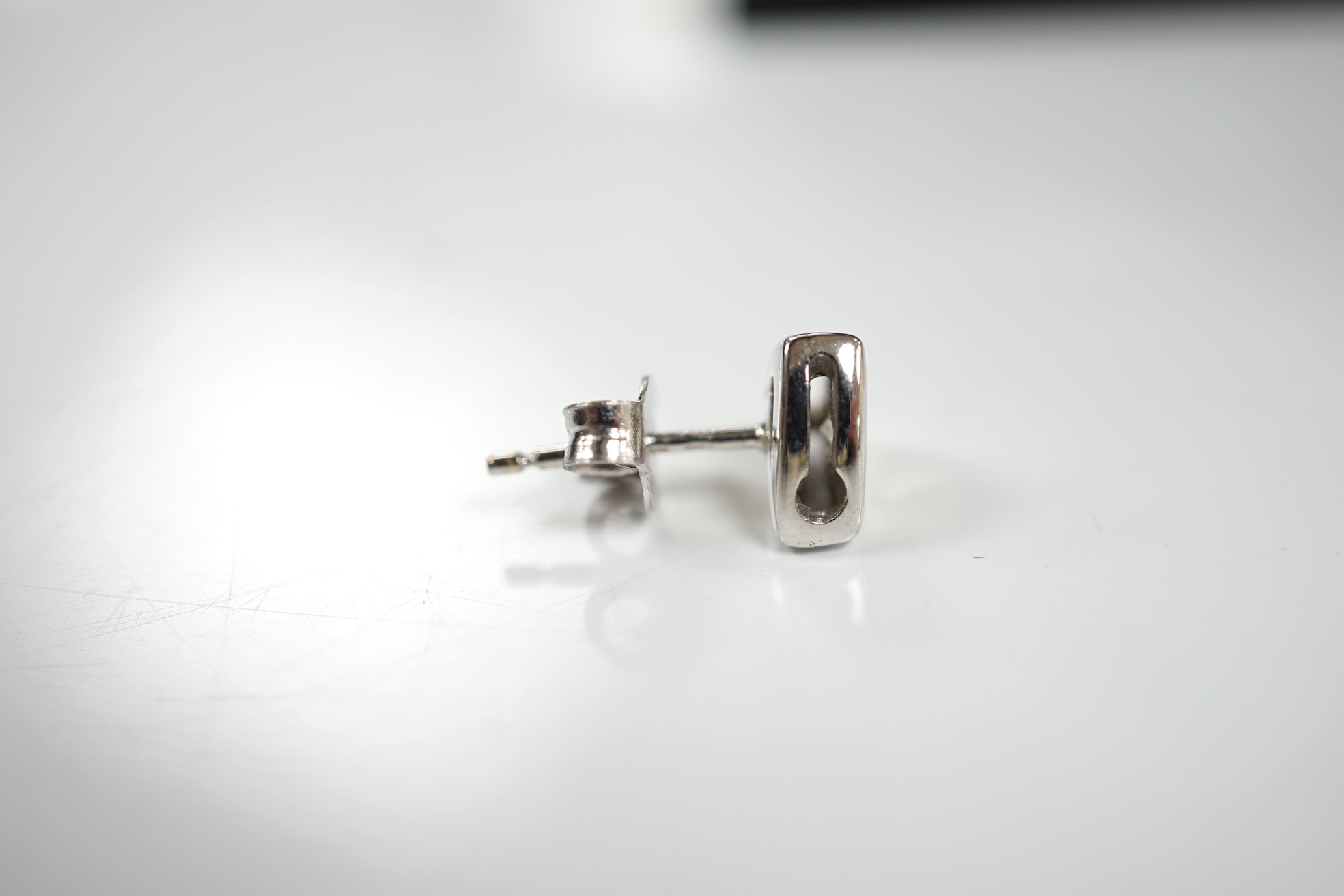 A modern pair of 18ct white gold and single stone diamond set ear studs, 6mm, gross weight 2.8 grams. Condition - fair to good